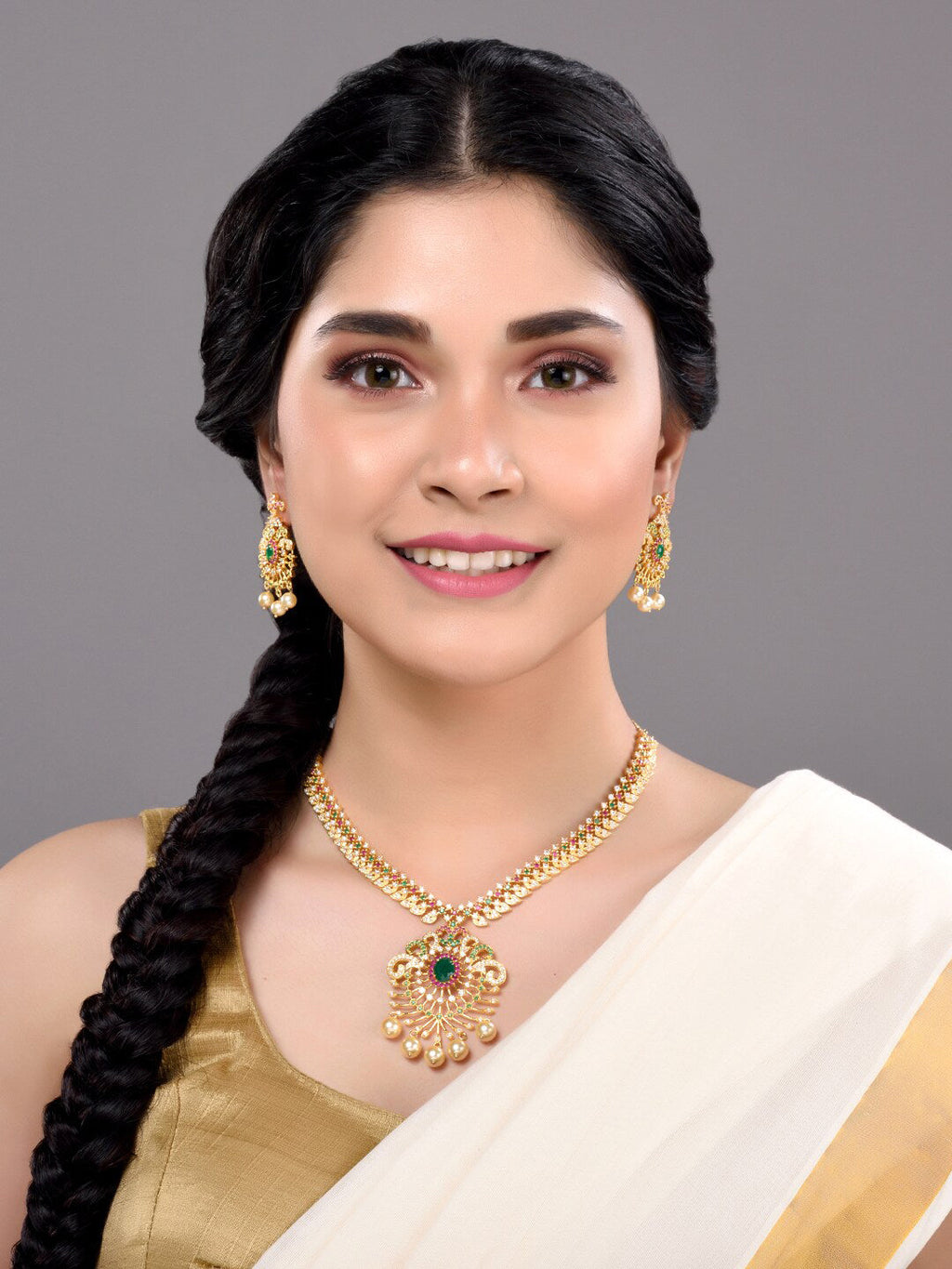 Saraf RS Jewellery Women Gold-Toned & Multi-Coloured CZ-Studded Handcrafted Jewellery Set