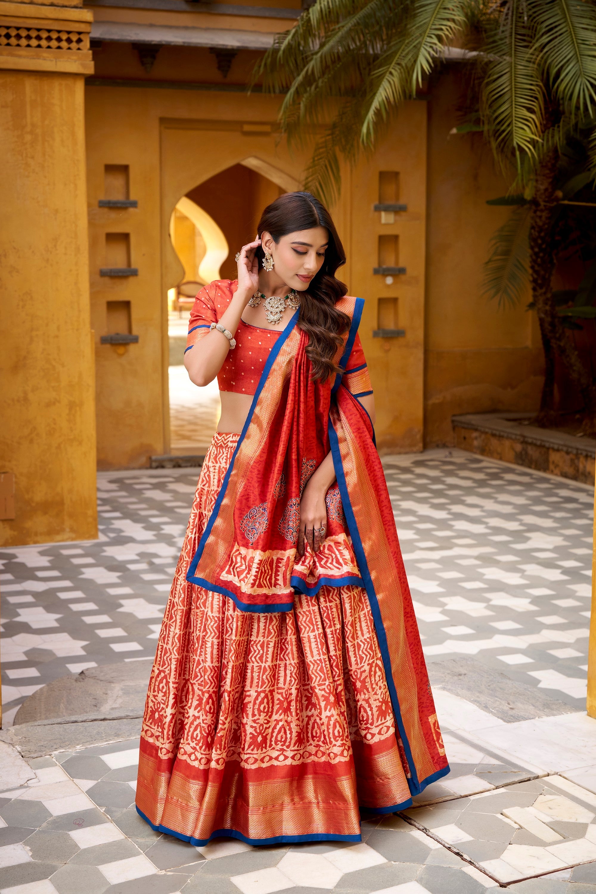 Lorenvalley Fashion Rust Dola Silk Batik Print with Zari Weaving Work Lehenga Choli with Dupatta