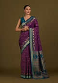 Monjolika Fashion Dark Purple Banarasi Silk Blend SareeIn Classic Paisley & Rich Zari Pallu Comes With Unstitched Blouse