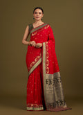 Monjolika Fashion Red Banarasi Silk Blend SareeIn Classic Paisley & Rich Zari Pallu Comes With Unstitched Blouse