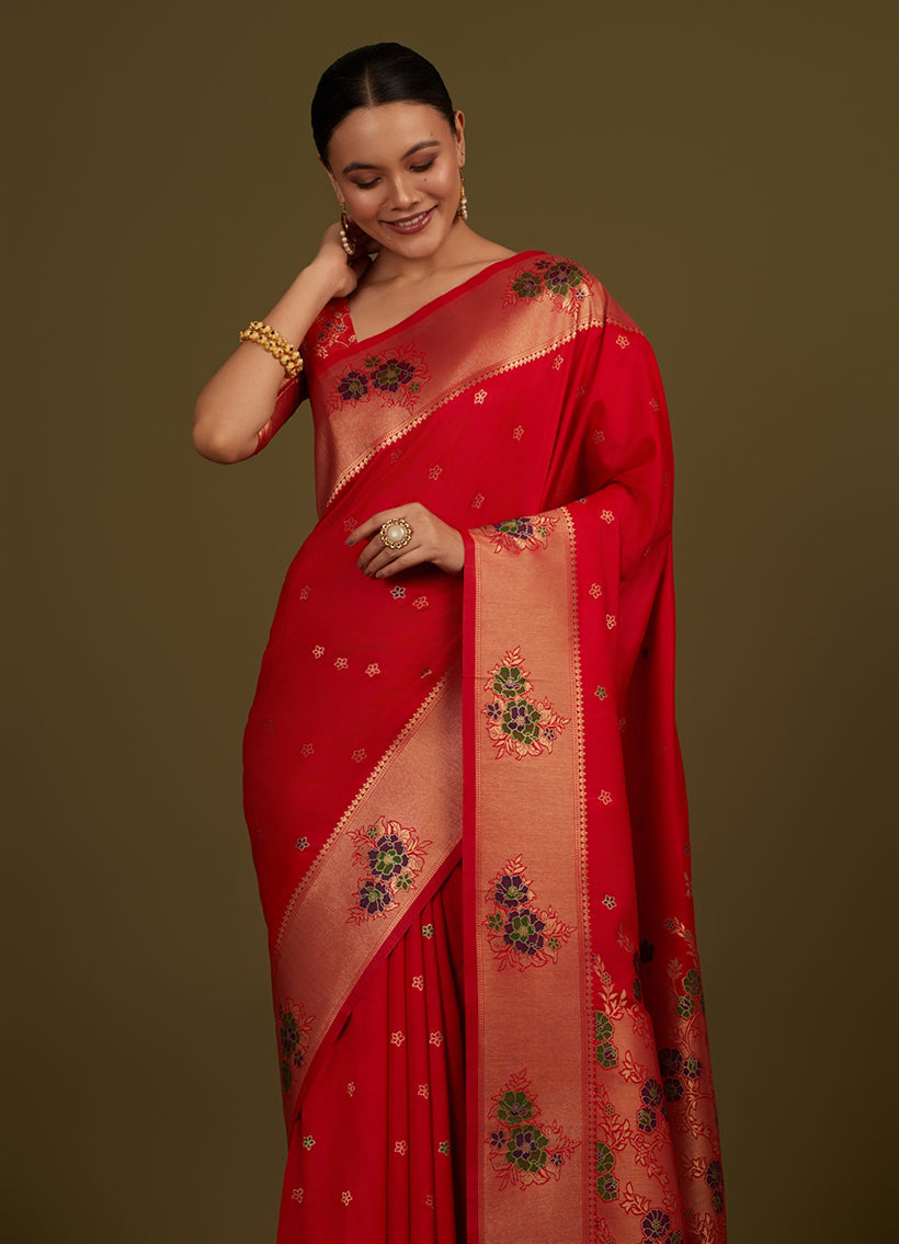 Monjolika Fashion Red Woven Silk Blend SareeWith Zari Work & Floral Motifs