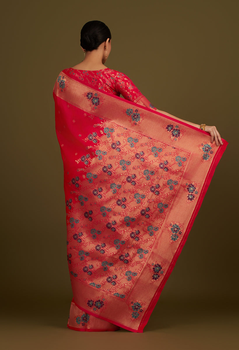 Monjolika Fashion Pink Woven Silk Blend SareeWith Zari Work & Floral Motifs