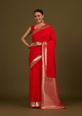 Monjolika Fashion Red Woven Silk Blend SareeWith Zari Work & Floral Motifs