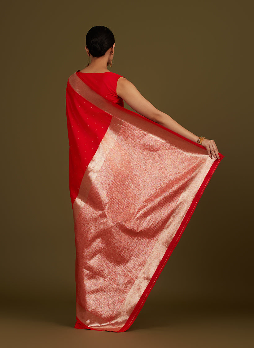 Monjolika Fashion Red Woven Silk Blend SareeWith Zari Work & Floral Motifs