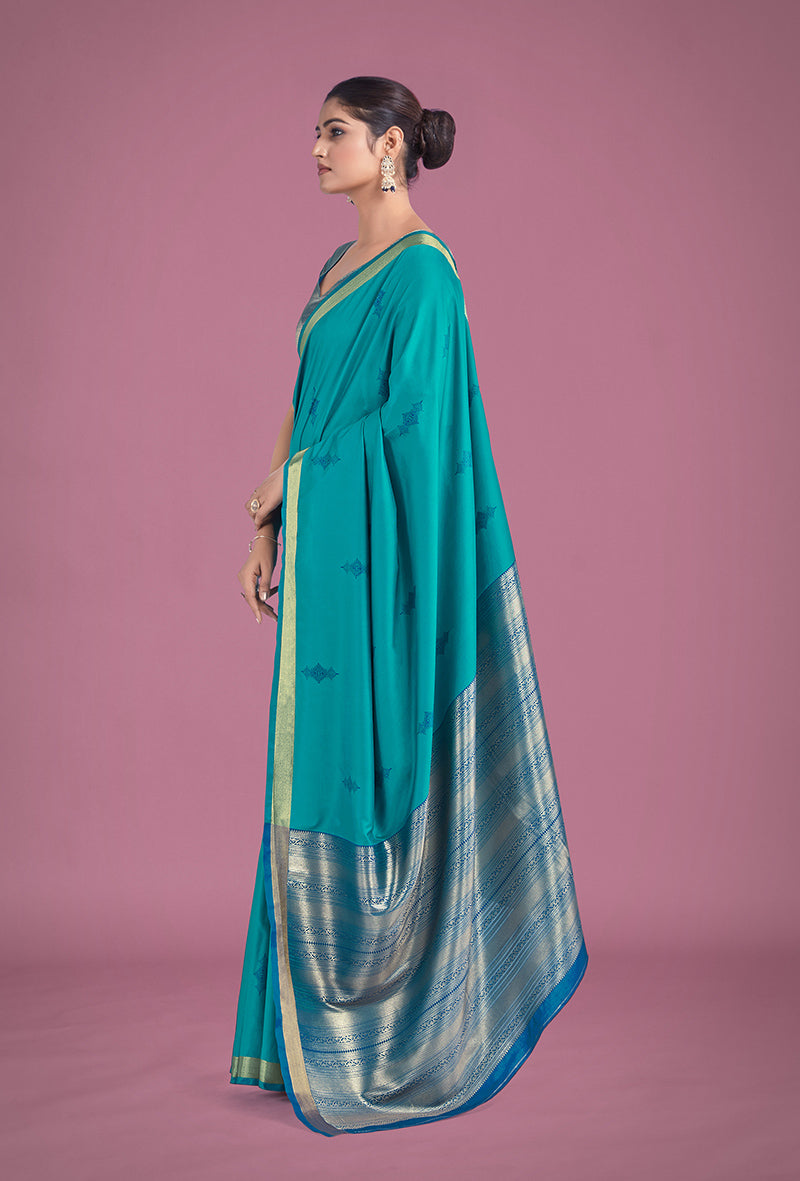 Monjolika Fashion Charming Turquoise Color Silk Golden Zari Woven Ceremony Saree