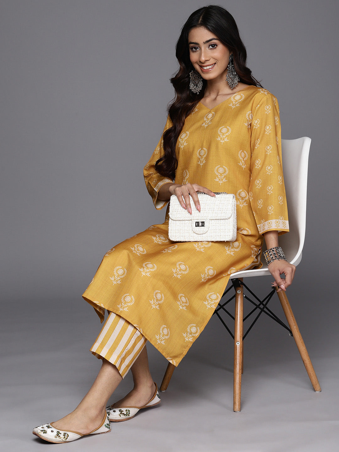 KSUT (House of Varanga) Mustard Digital Printed Kurta With V Neckline Paired With Straight Trouser