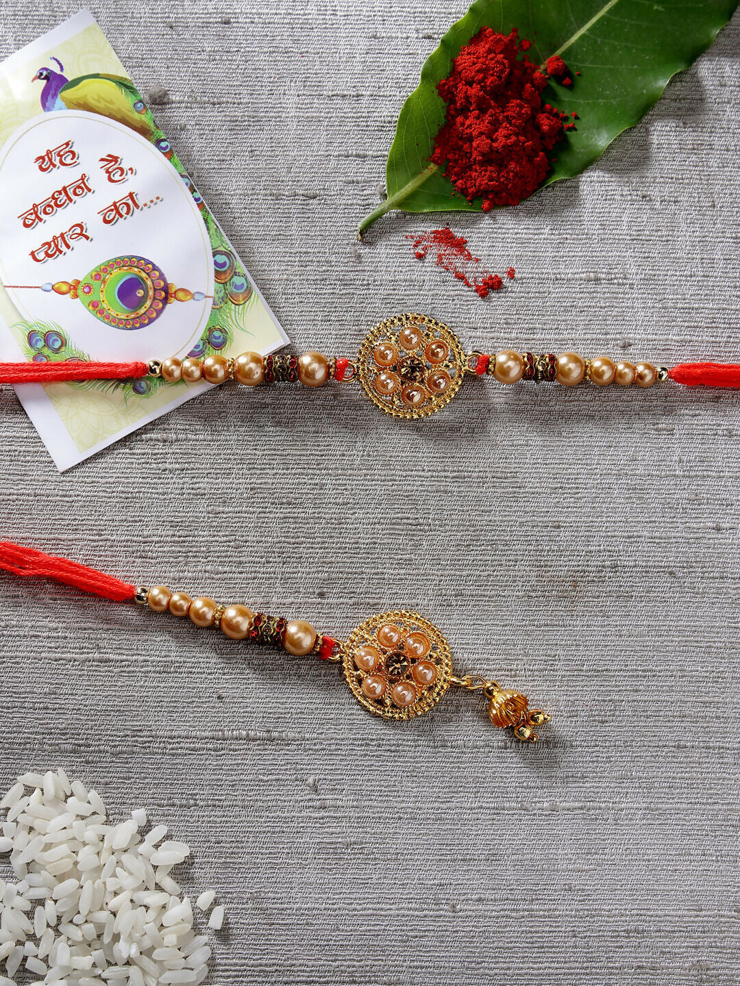 NVR Women & Men Set of 2 Gold-Toned Stone-Studded & Beaded Bhaiya Bhabi Rakhi With Roli Chawal