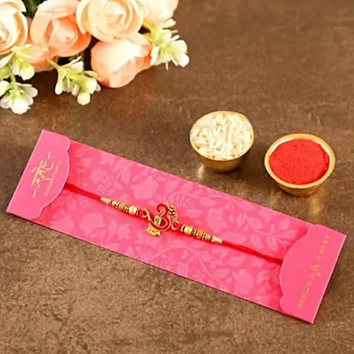 Auspicious Om Pearl Rakhi & Kaju Roll Box