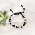 NVR Women & Men Black Evil Eye Rakhi With Roli Chawal
