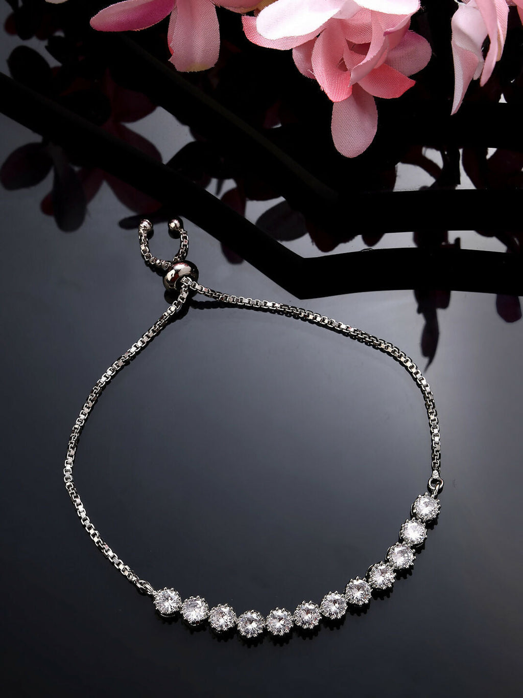 NVR Women Silver-Plated Handcrafted American Diamond Link Bracelet