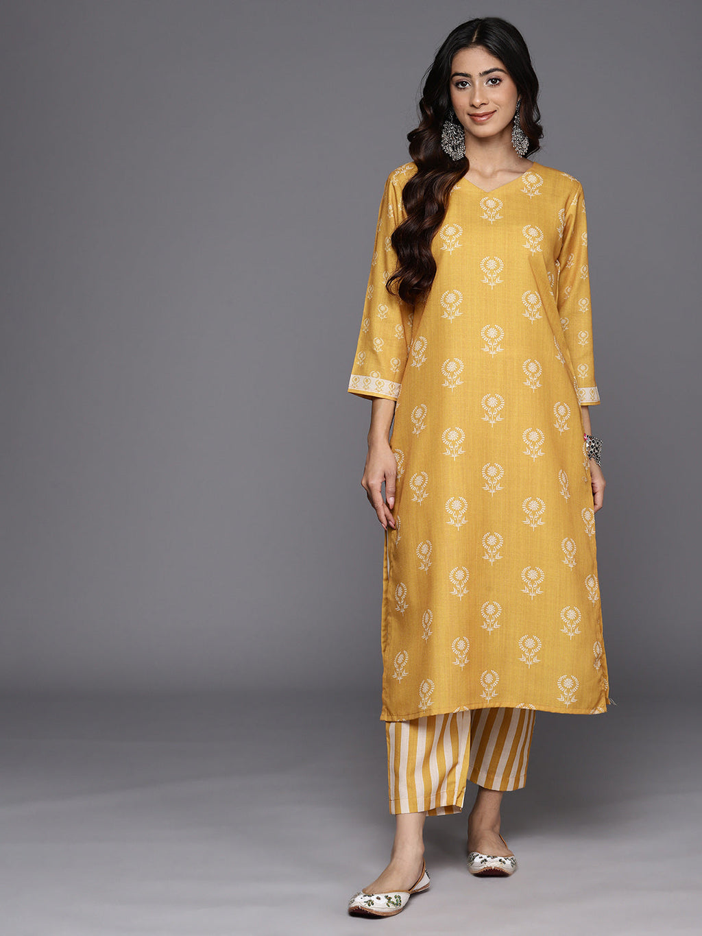 KSUT (House of Varanga) Mustard Digital Printed Kurta With V Neckline Paired With Straight Trouser