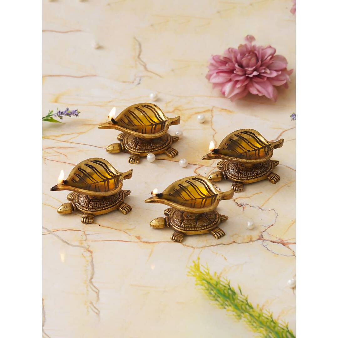 eCraftIndia 4 Pieces Beige Tortoise Statue Leaf Design Diyas