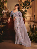 Monjolika Fashion Designer Light Lilac Tissue Organza Saree With All Over Butta Work & Heavy Stone Embellished Border