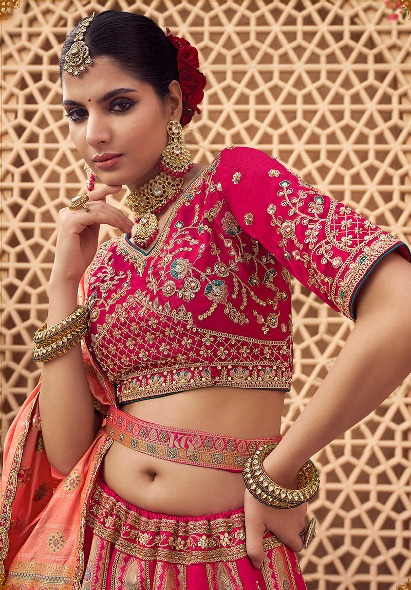 Monjolika Fashion Rani Pink & Peach Banarasi Silk Wedding Wear Lehenga With Embroidery Work