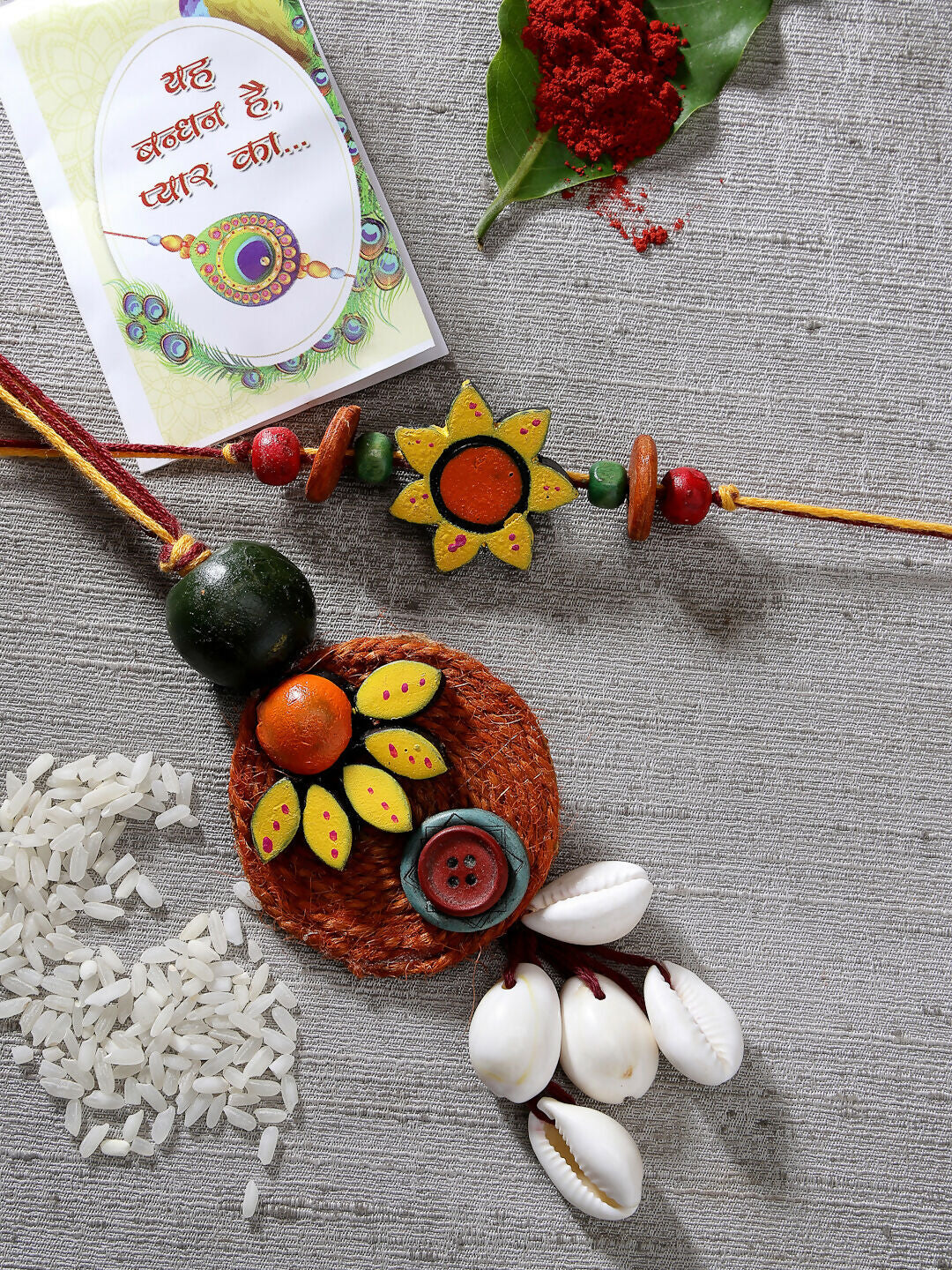 NVR Women & Men Set of 2 Multicolor Sea Shell Handcrafted Bhaiya Bhabhi Rakhi With Roli Chawal & Chocolate