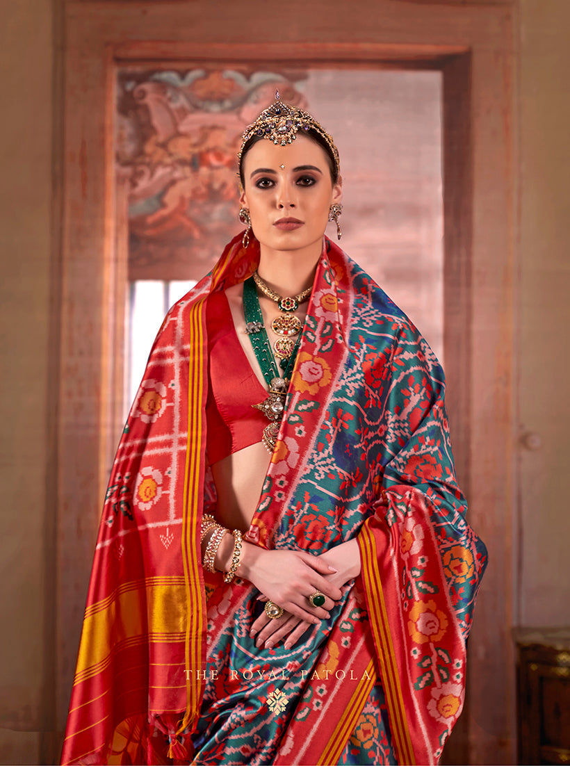 Monjolika Fashion Teal Silk Blend Patola Print Saree with Red Blouse