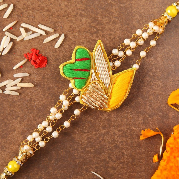 Meenakari Glimming Rakhi & Kaju Rolls Box