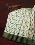 Half White And Parrot Green Colour Ikat Design Semi Chanderi Saree By Gayathri Reddy Designer Studio