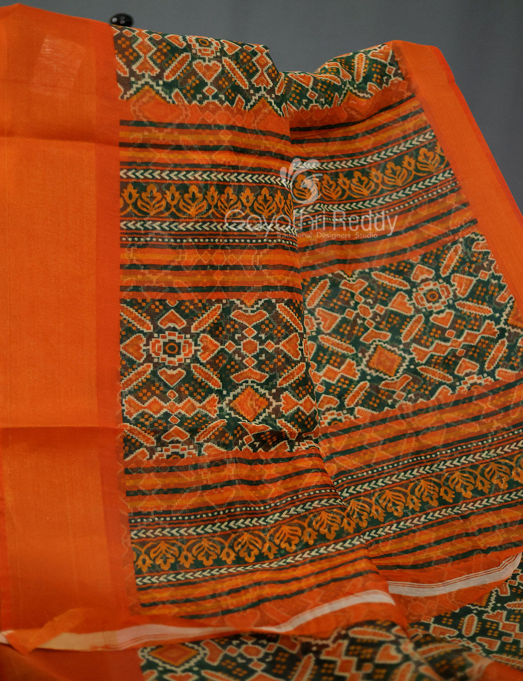 Shades of Dark Green And Orange Colour Patola Print Semi Chanderi Saree By Gayathri Reddy Designer Studio