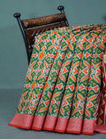 Shades of Navy Parrot Green Colour Patola Print Semi Chanderi Saree By Gayathri Reddy Designer Studio
