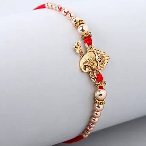 Auspicious Ganesha Rakhi And Kaju Rolls Box