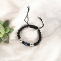 NVR Women & Men Black Evil Eye Rakhi With Roli Chawal