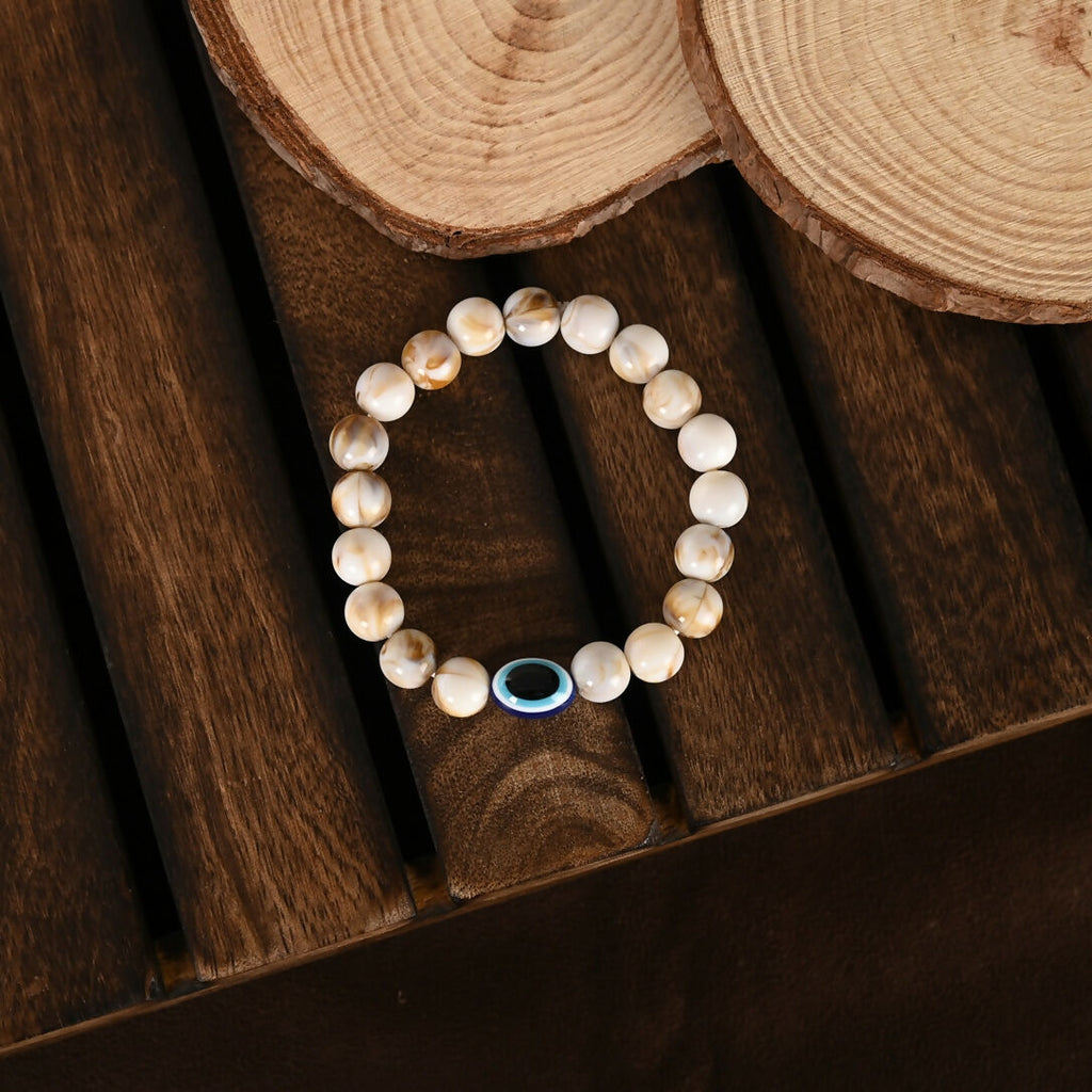 NVR Women & Men Cream-colored Evil Eye Elasticated Rakhi With Roli Chawal