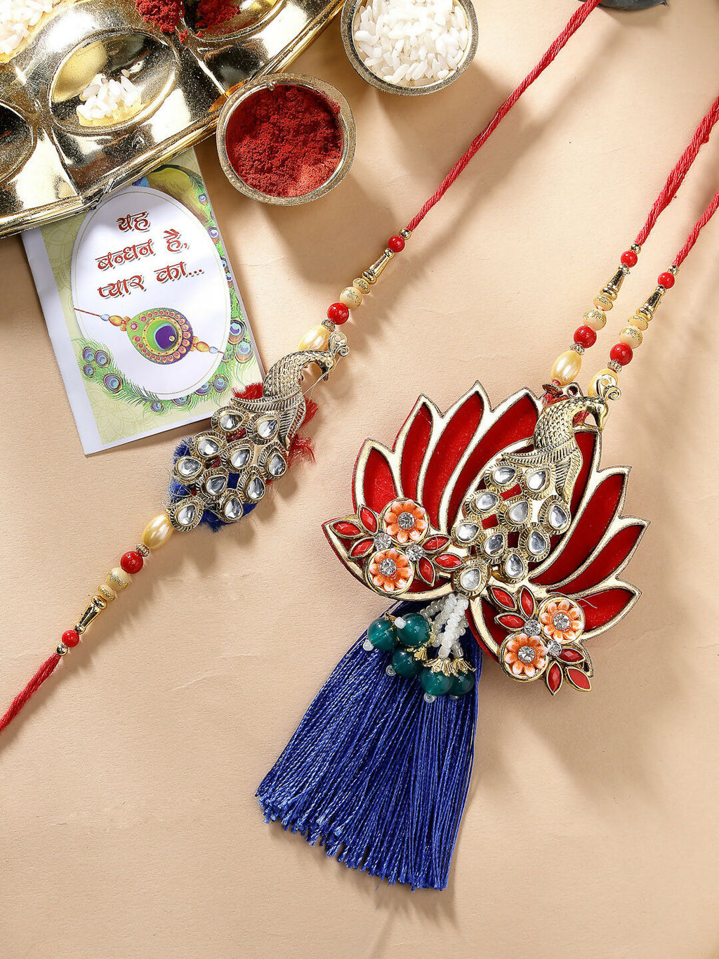 NVR Women & Men Set of 2 Gold-Toned Peacock Design Stone-Studded Bhaiya Bhabhi Rakhi With Roli Chawal