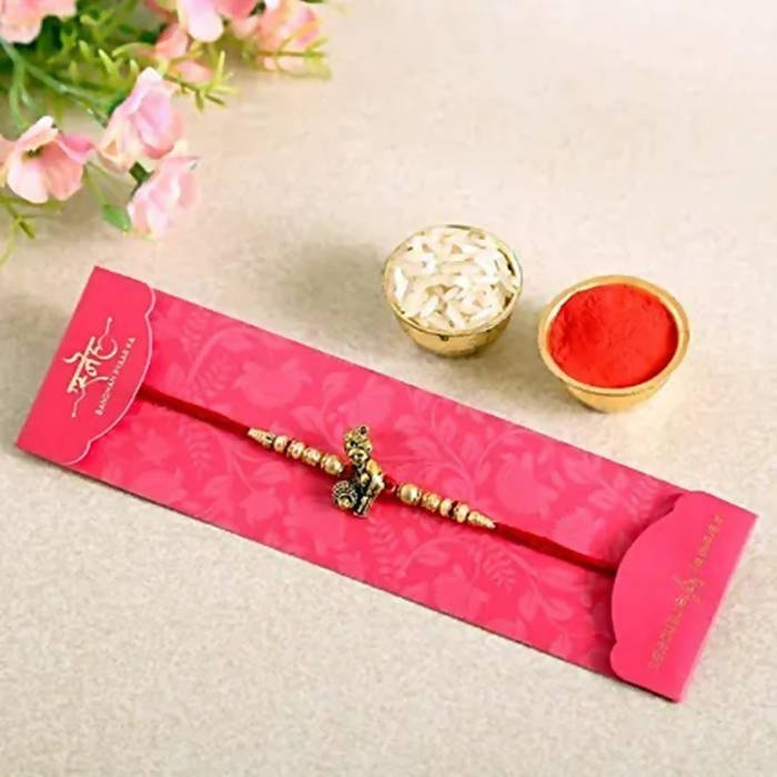 Divine Lord Krishna Pearl Rakhi & Cashew Jar
