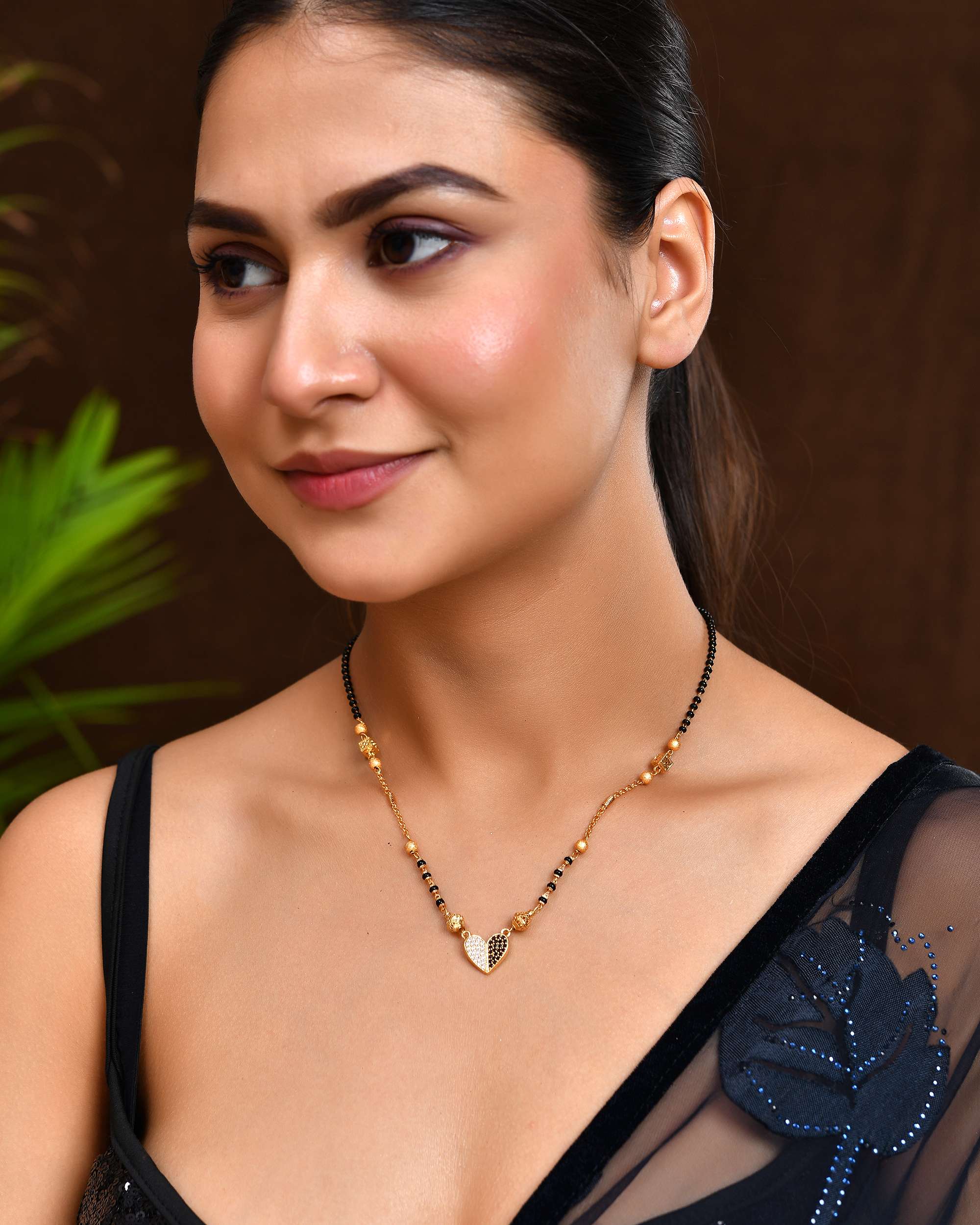 Jewels Nest Dual-Toned Artificial Stone Heart Mangalsutra with Golden Beads