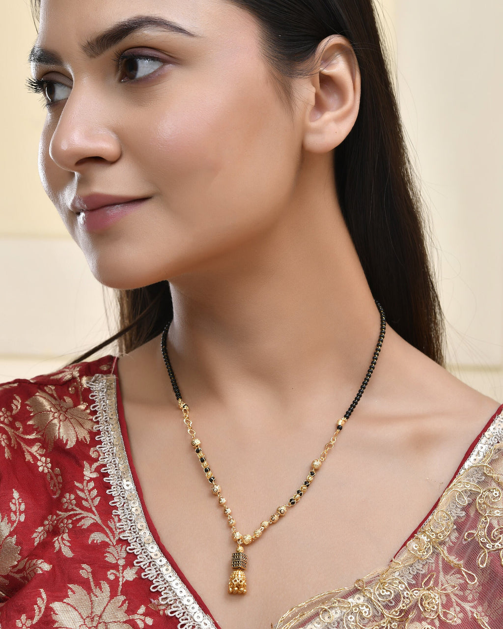 Jewels Nest Graceful Gold-Polished Black Bead Mangal Sutra with Intricate Pendant