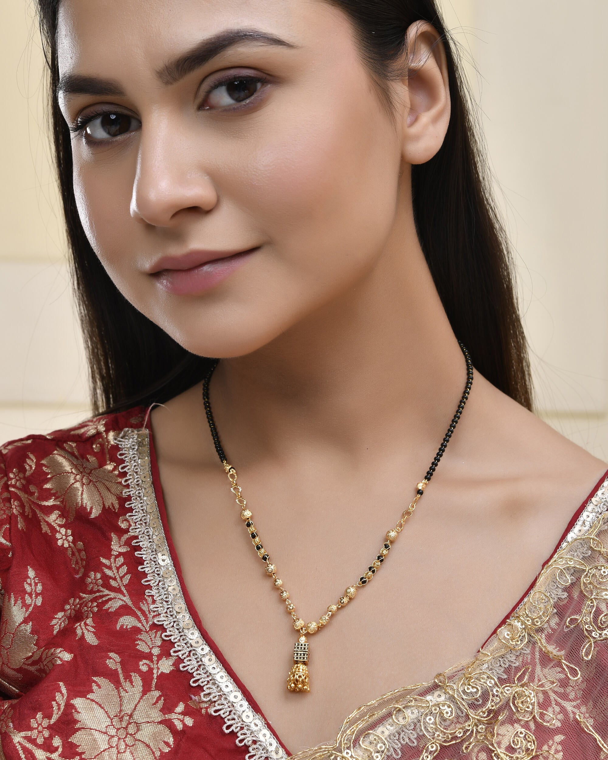 Jewels Nest Graceful Gold-Polished Black Bead Mangal Sutra with Intricate Pendant