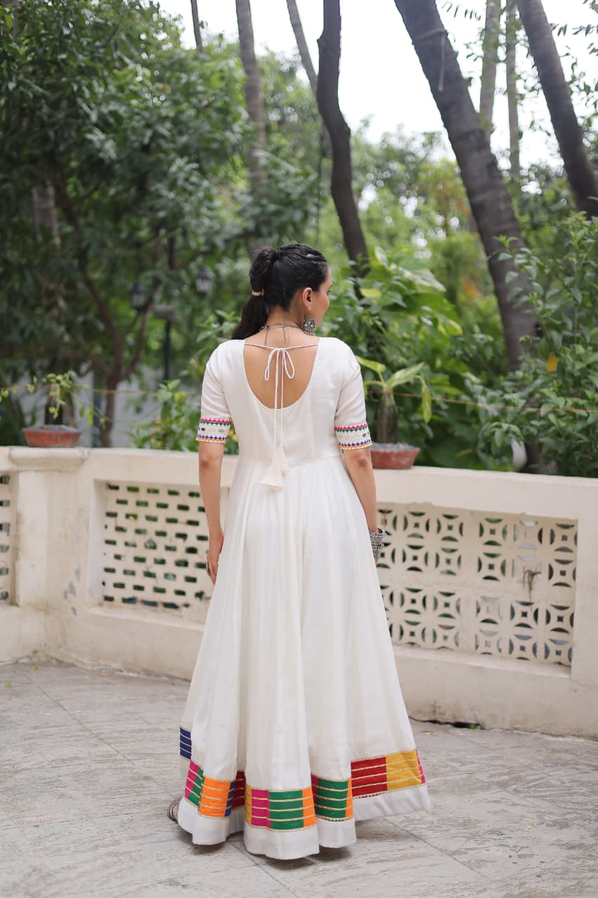 Prazu Fashion White Roman Silk Multicolor Thread And Mirror Work Navratri Gown