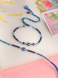NVR Set of 2 Blue Evil Eye Artificial Beads Bhaiya Bhabhi Rakhi with Roli Chawal Chandan & Mishri