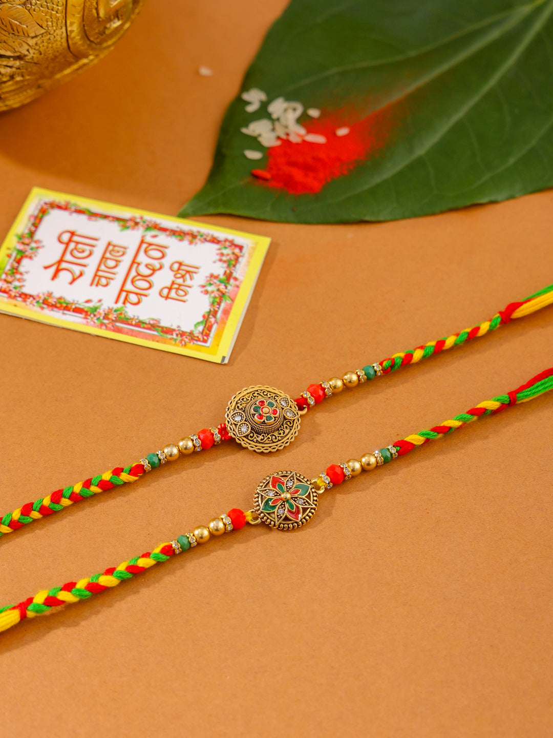 NVR Men Set of 2 Multicolor Floral Design Artificial Stones Thread Rakhi with Roli Chawal Chandan & Mishri