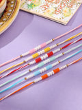 NVR Men Set of 6 Multicolor Pearls Thread Rakhi with Roli Chawal Chandan & Mishri