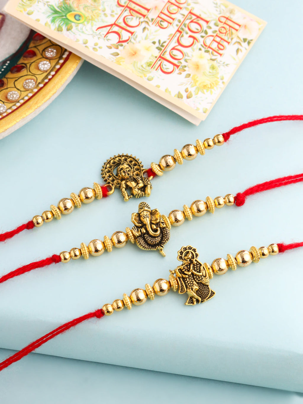 NVR Men Set of 3 Gold Toned Designer Ganesh Ji Thread Rakhi with Roli Chawal Chandan & Mishri