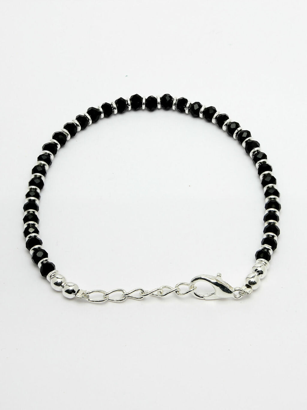 NVR Women Silver Plated Black Beaded Adjustable Rakhi With Roli Chawal