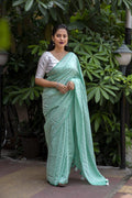 Green Poly Georgette Woven Design Saree with Unstitched Blouse - Hiral Fashion