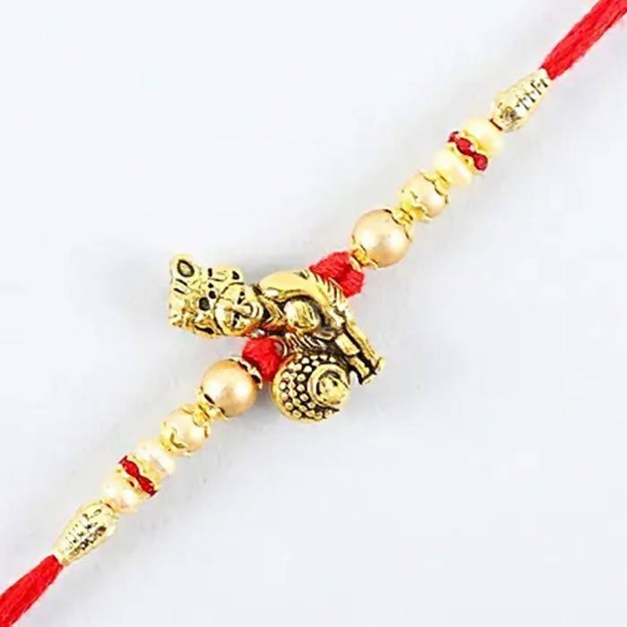 Divine Lord Krishna Pearl Rakhi & Cashew Jar