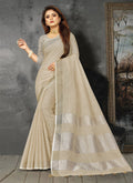 Shree Shyam Fashion Elegant Cream Woven Linen Saree with Contrast Zari Border & Tassels - Soft & Breathable Party Wear