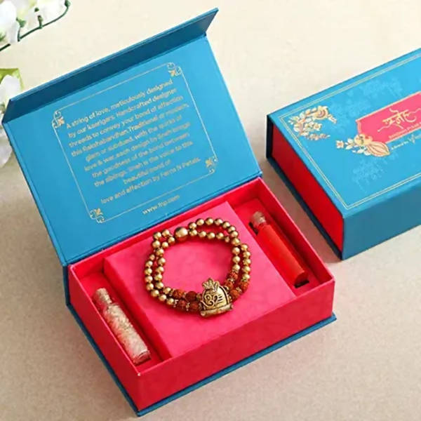 Om Pearl Bracelet Rakhi & Fruit N Nut Chocolates