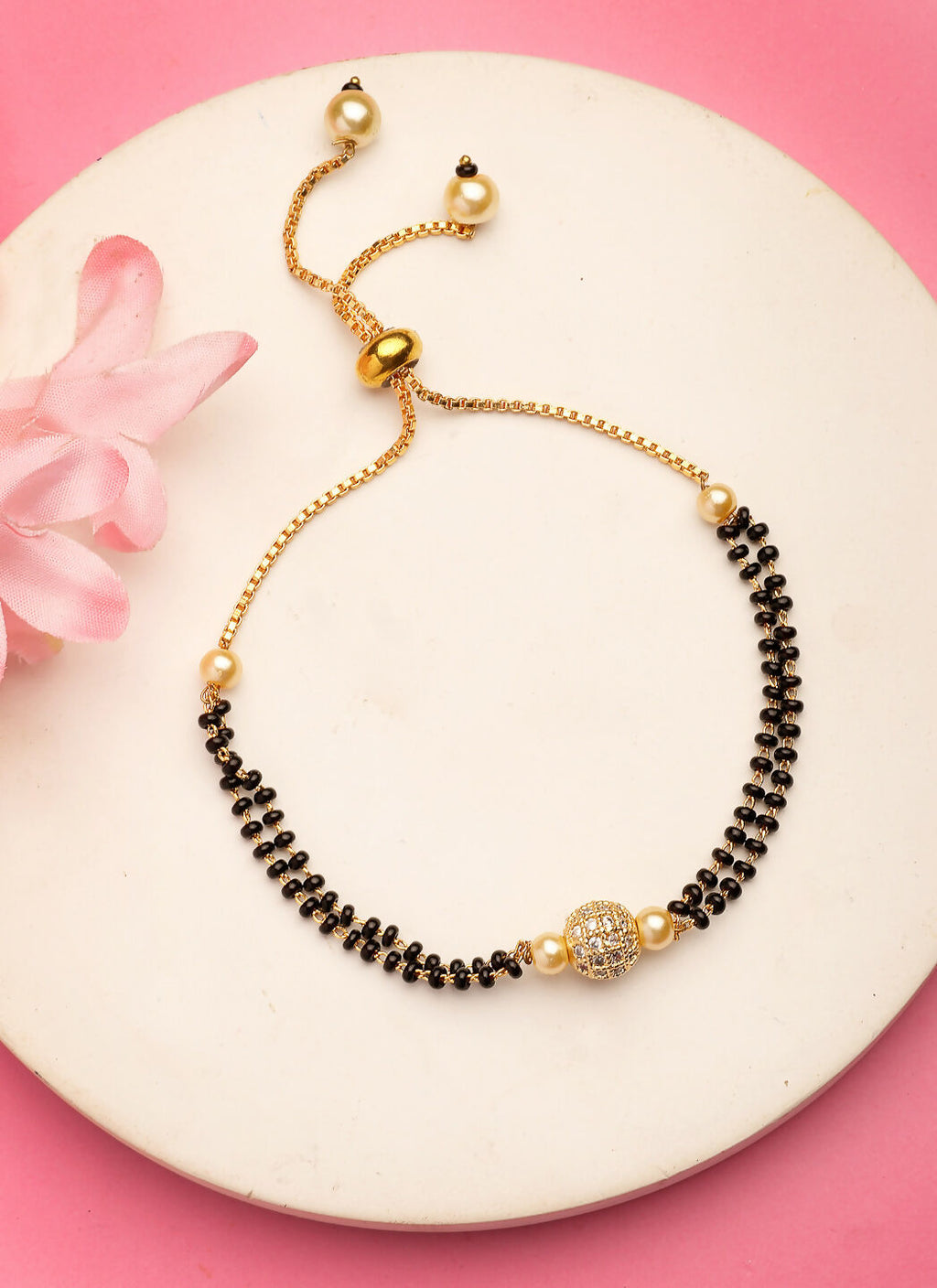 NVR Women Gold-Polished & Black Brass AD-Studded Hand Mangalsutra Bracelet