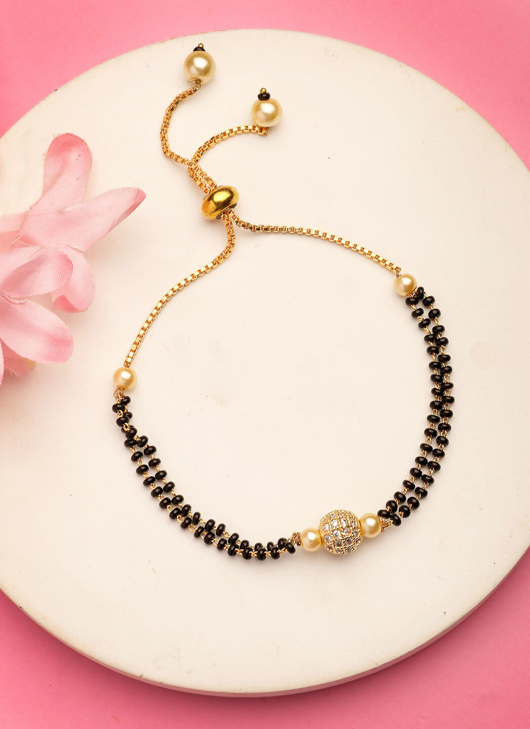 NVR Women Gold-Polished & Black Brass AD-Studded Hand Mangalsutra Bracelet