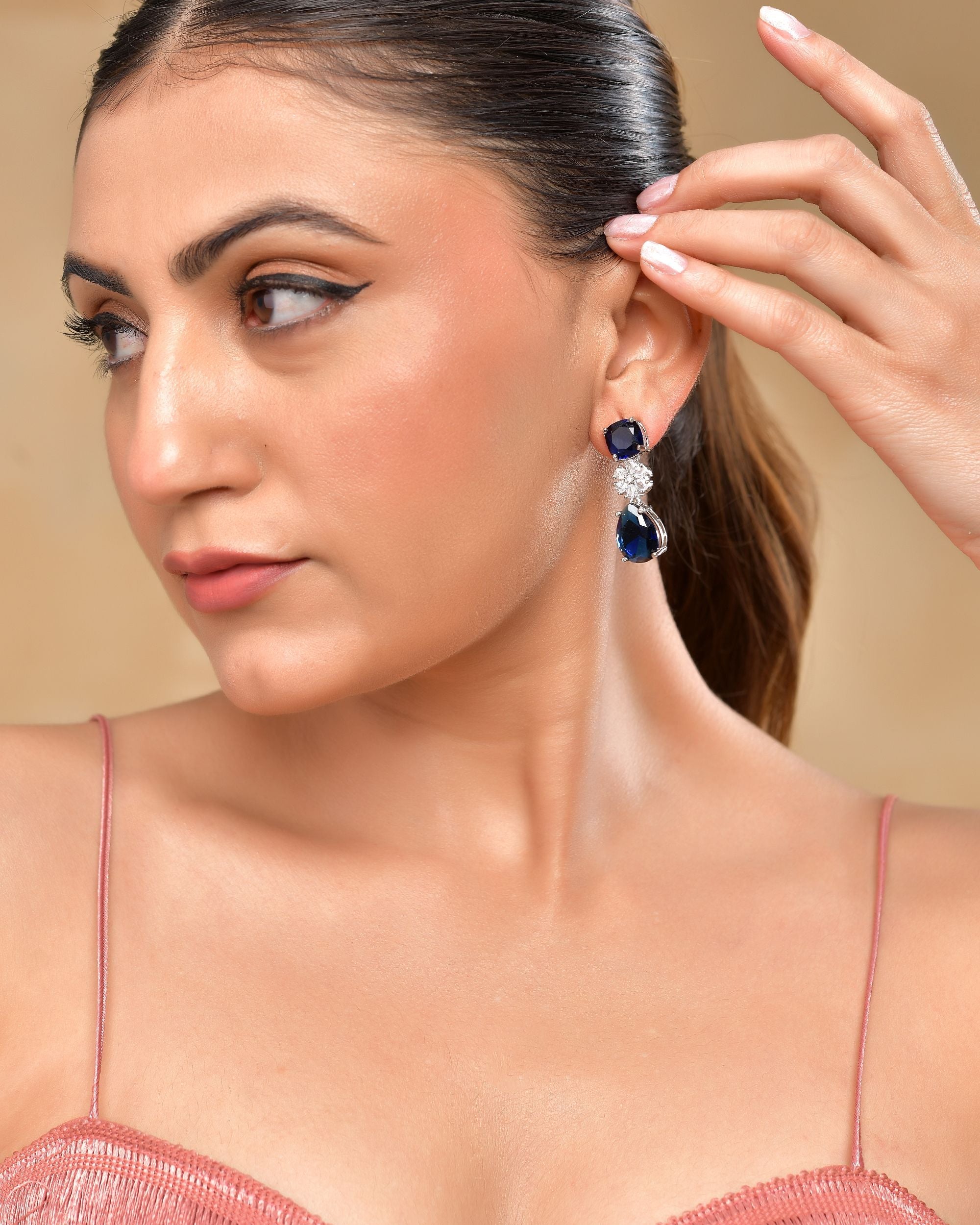 VOJ Silver Plated Blue Stone Studded Floral Shaped Studs Earrings