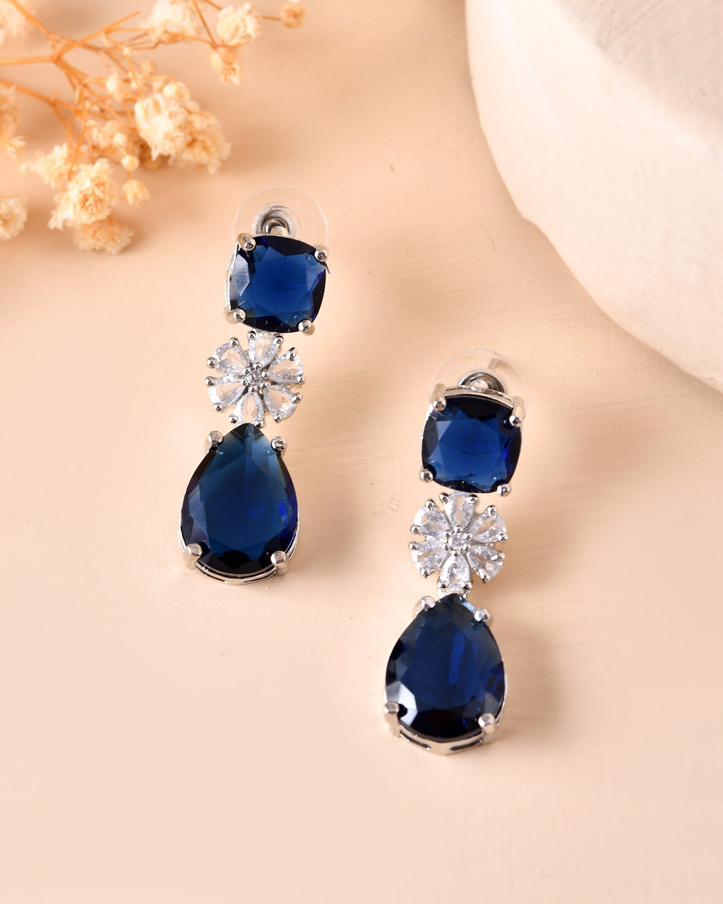 VOJ Silver Plated Blue Stone Studded Floral Shaped Studs Earrings