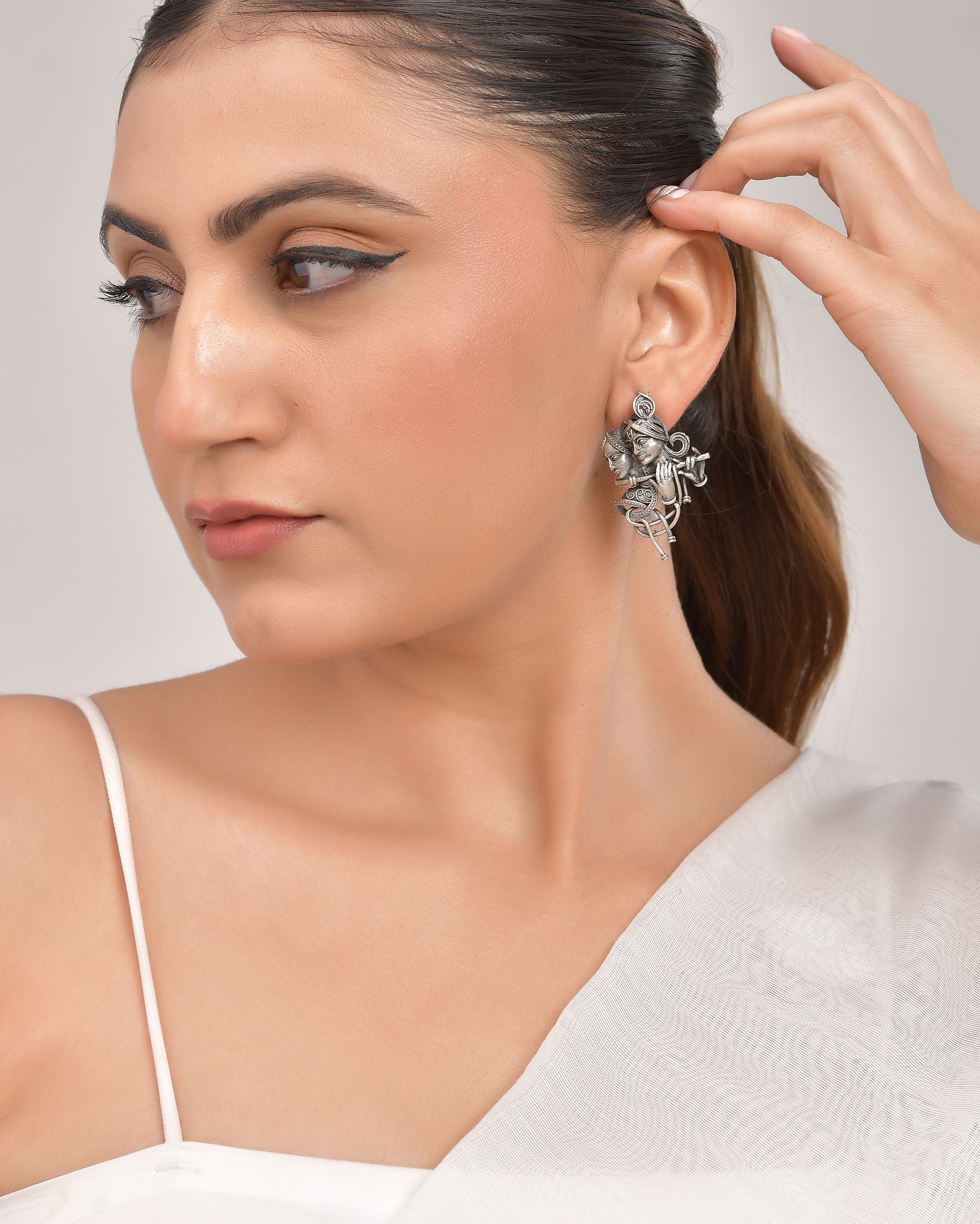 VOJ Silver Plated Oxidized Kanha Shaped Earrings