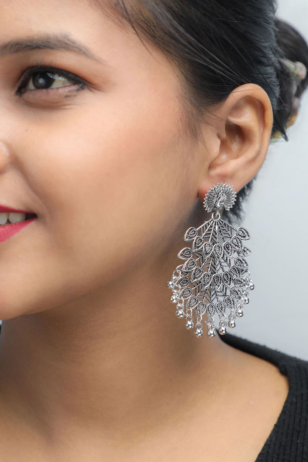 VOJ Silver Plated Oxidised Peacock Shaped Studded Earrings