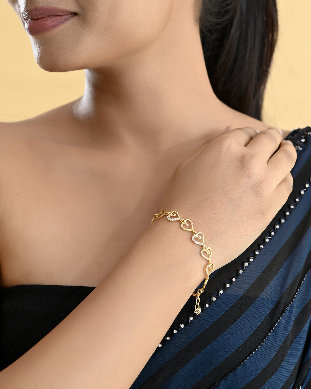 VOJ Gold-Polished Heart Shapped AD Stone Studded Women's Bracelet