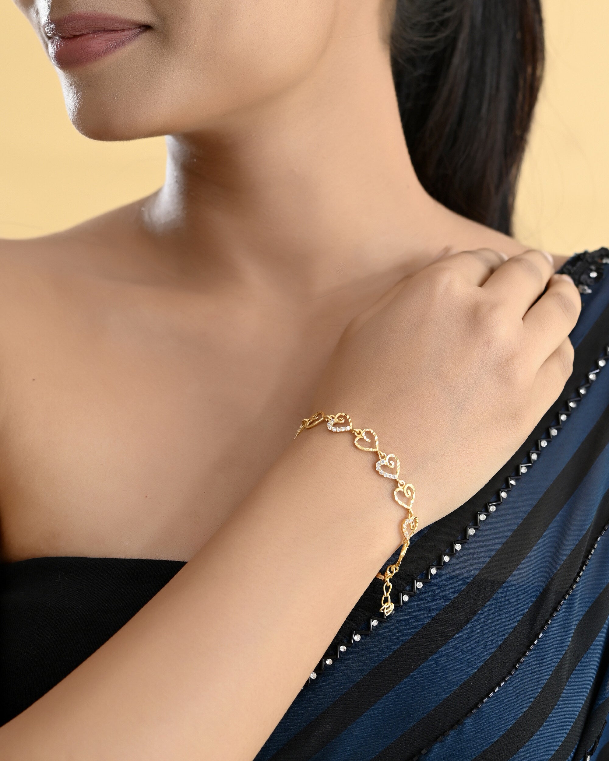 VOJ Gold-Polished Heart Shapped AD Stone Studded Women's Bracelet